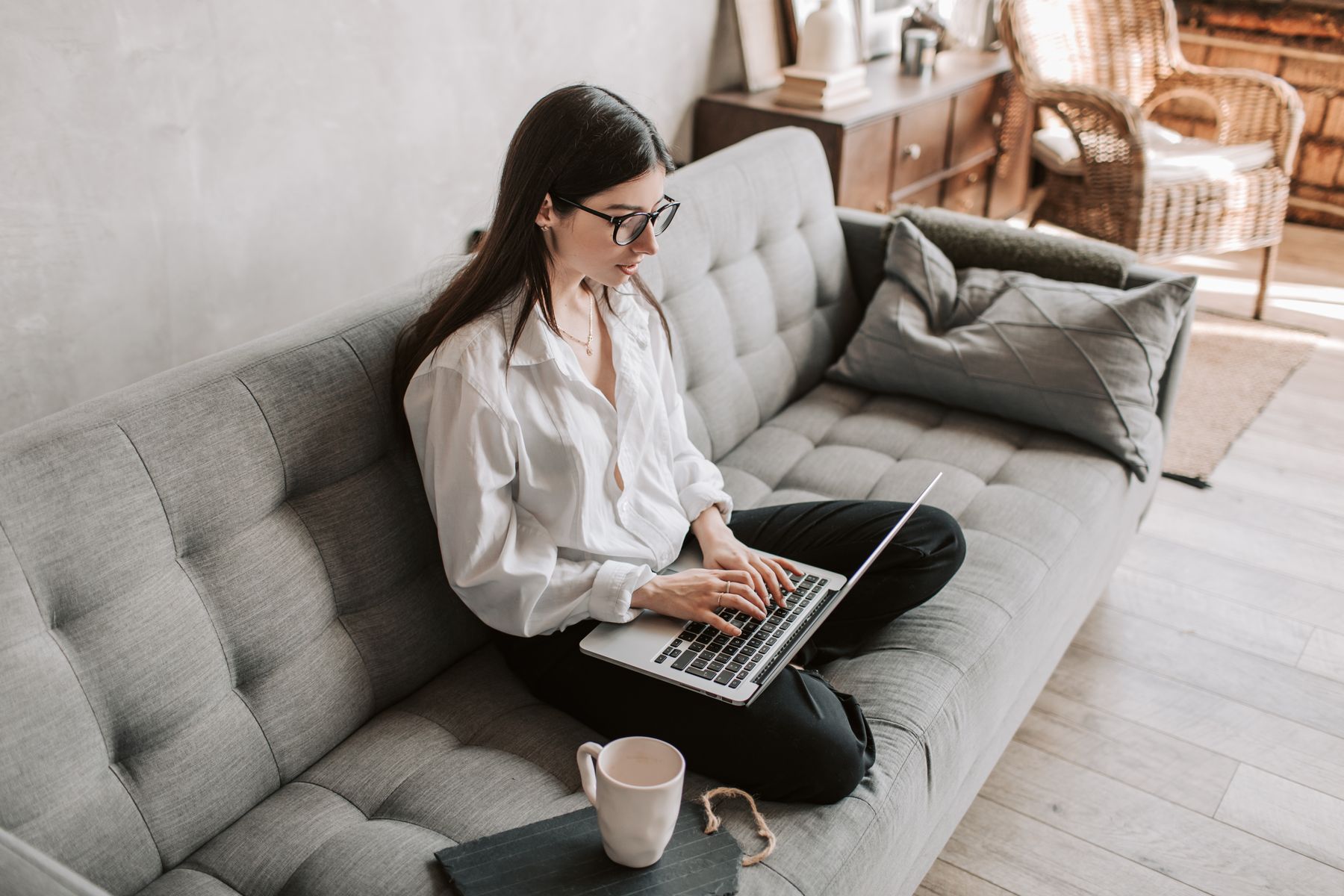 A woman using her laptop at home